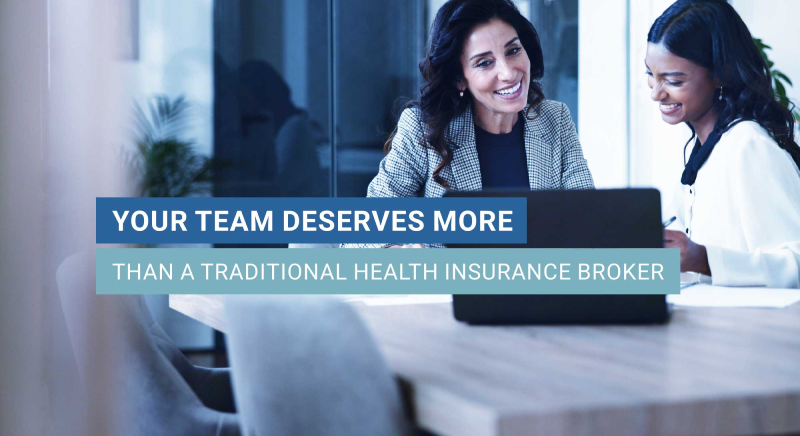 Two women at a conference table your team deserves more than a traditional health insurance broker